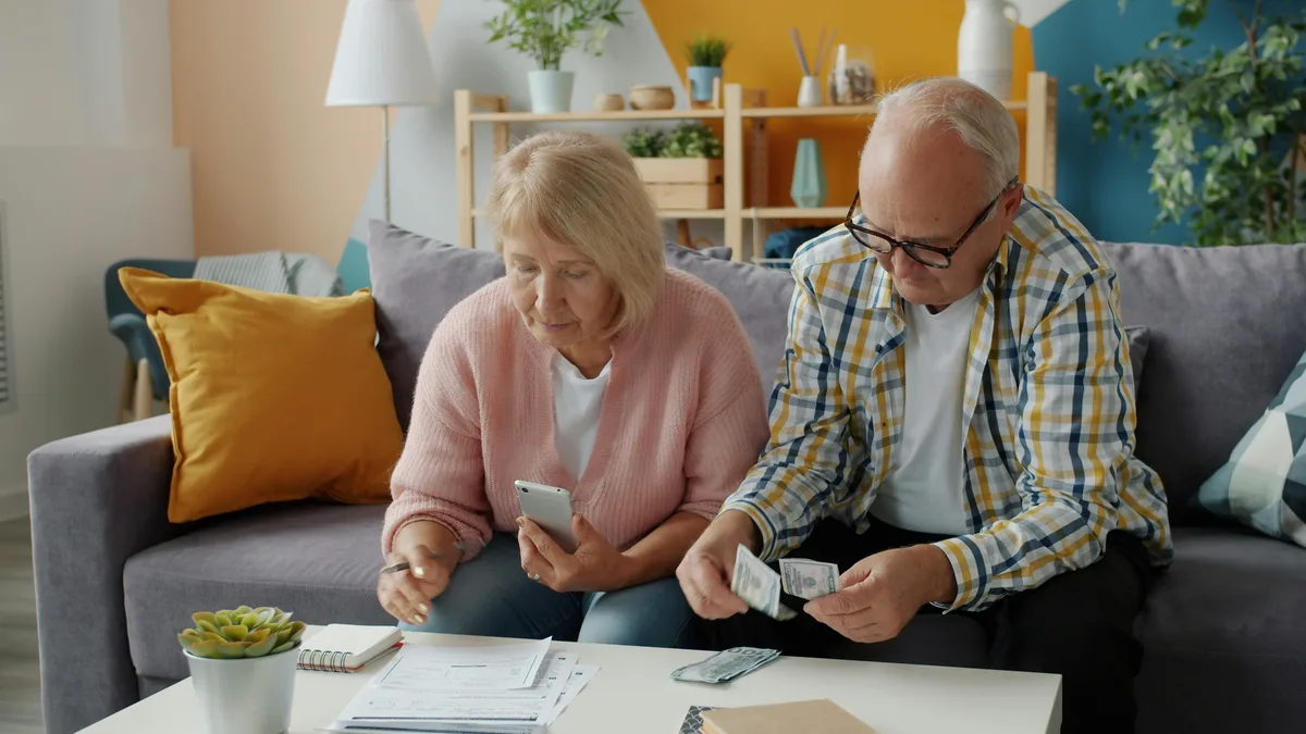 2026 senior deduction — elderly couple managing retirement finances and tax planning at home